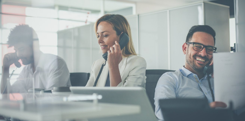 IT employees talking with clients on phone about Managed IT Services Pricing - For Brisbane's most affordable Managed IT Services Pricing contact IT Services Brisbane