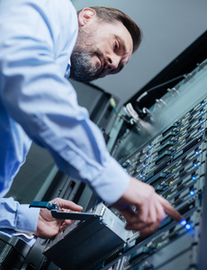 Bearded man working on a network server