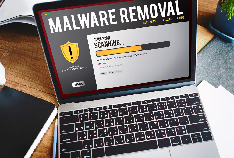 A MacBook currently undergoing a malware removal process